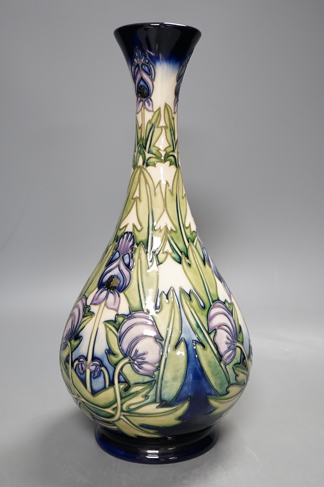 A Moorcroft 'wolfsbane' vase by Anji Davenport, 8.11.01, 99/350, 30 cms high.